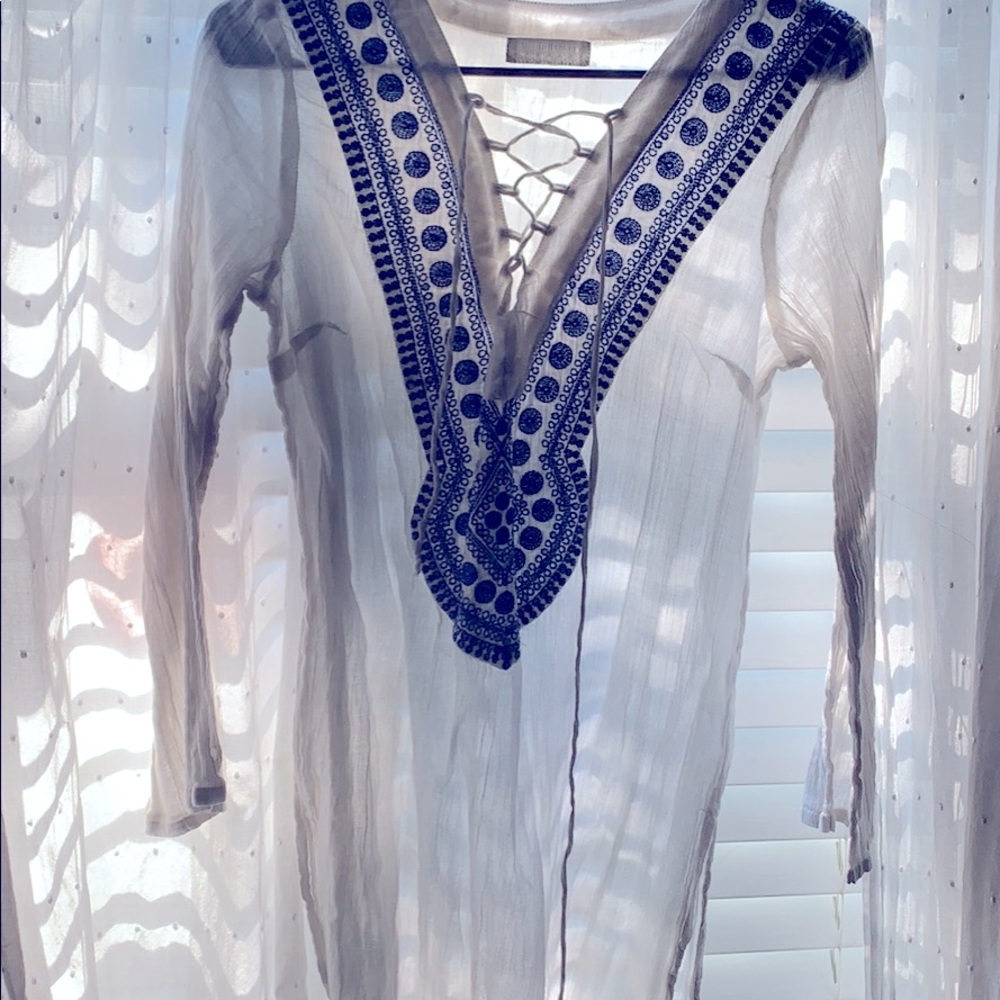 light weight thin material. Great for a cover up or with a pair of leggings!